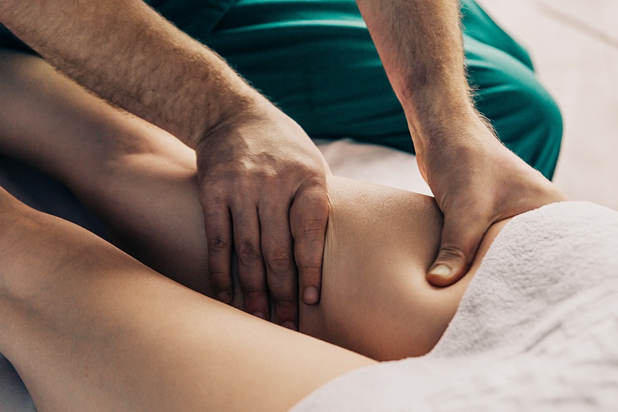 Lymphatic drainage massage of the hips.