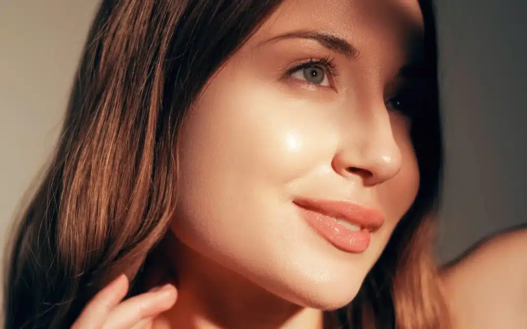 Close-up of a person with tight, youthful skin and a defined cheek, representing the lifting and smoothing results of EMFACE.